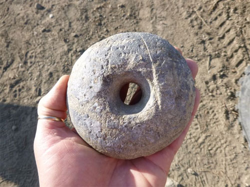 Mundane digging stick weight or ritual/ceremonial artifact? So-called â€œdonut stoneâ€ of granite, Yokut culture. Found near Buttonwillow, Kern County, California.