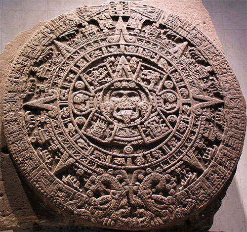 Fig. 20: The Aztec Sun Stone with sun god Tonatiuh in the center, surrounded by several concentric layers of day signs and jewel symbols.