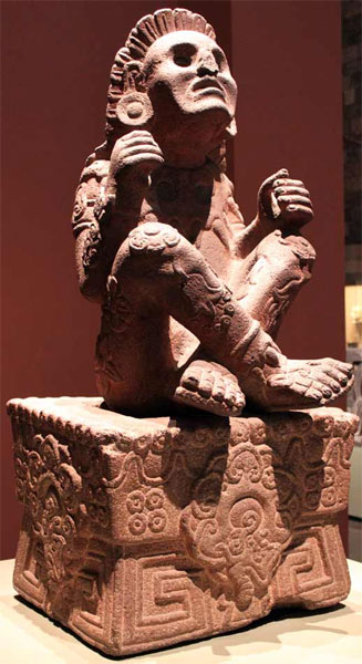 Fig. 27: Aztec flower prince Xochipilli with flower ornaments on earspools, knees, legs and the pedestal (cp. Taube 2004).