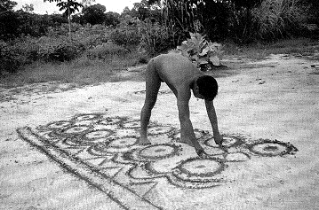 Figure 9: A Barasana (Tukano) draws rows of dotted circles in the sand